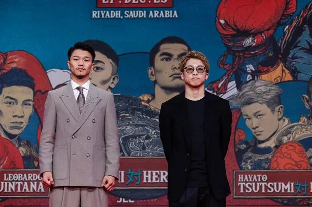 Junto Nakatani (left) and Naoya Inoue (right) pose for photographers at the press conference,